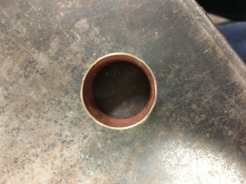 My chain link on a table, seen from directly above. The shiny top edge and matte pink inside are both visible.
