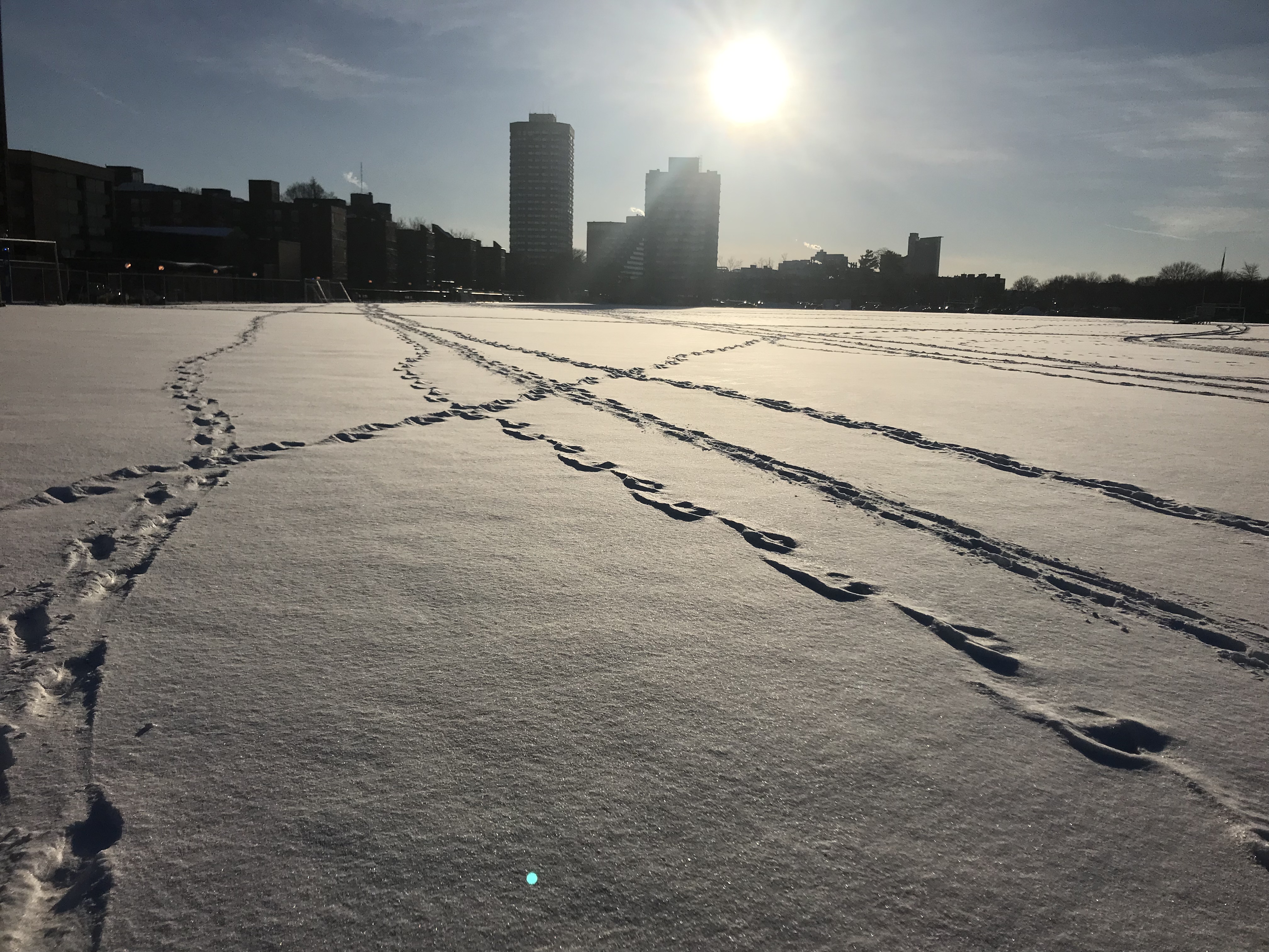 snow on the football field with footprints