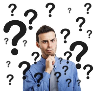 stock photo man surrounded by question marks