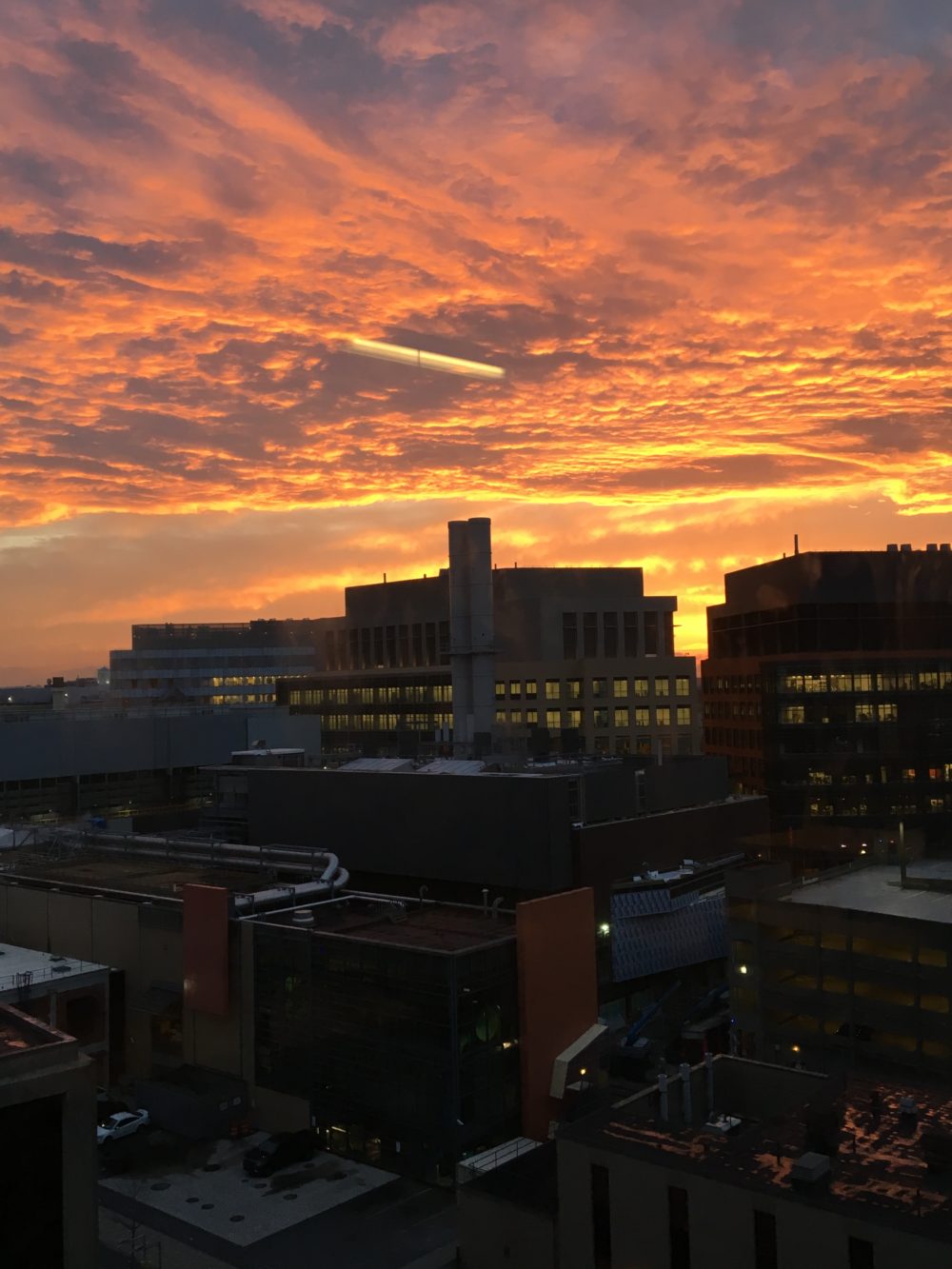 A fiery sunset over some MIT buildings.