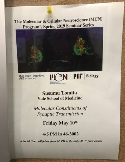 a poster advertising a Susumu Tomita molecular and cellular neuroscience seminar entitled molecular constituents of synaptic transmission
