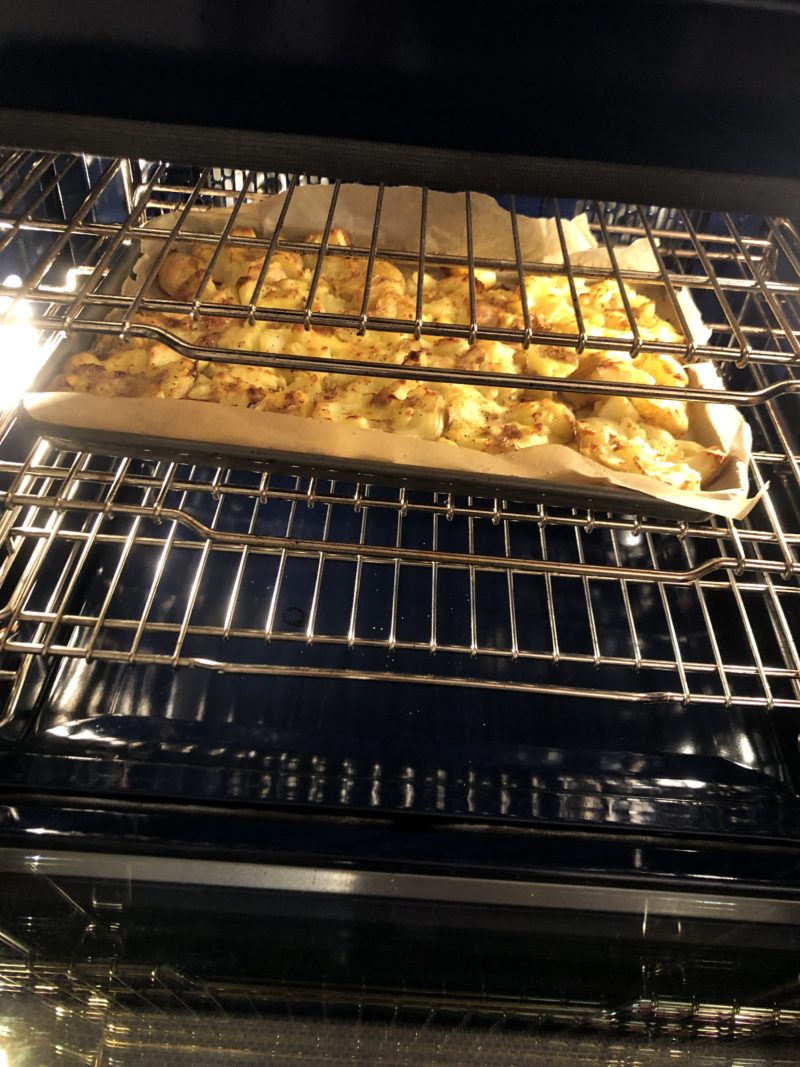 image of smashed potatoes in oven