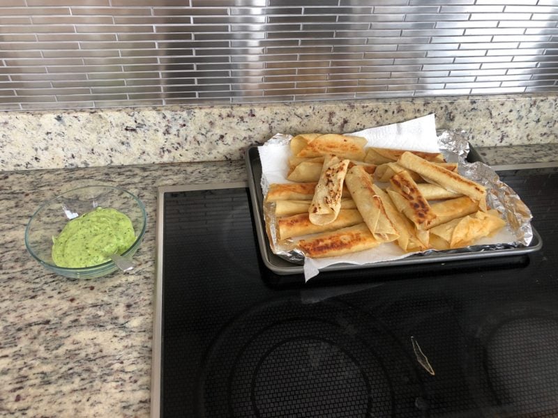 picture of taquitos and green sauce