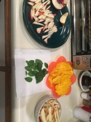 The ingredients for the summer rolls: chopped nectarine and apple, mint, and mango (rice not pictured).