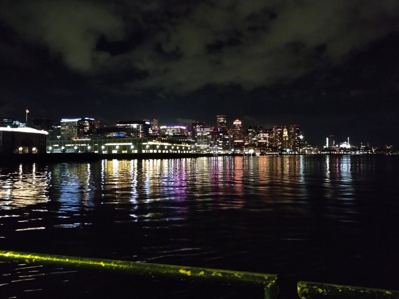 A picture of the Boston skyline from a boat.