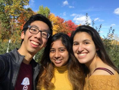 picture of freshmen with fall leaves in background