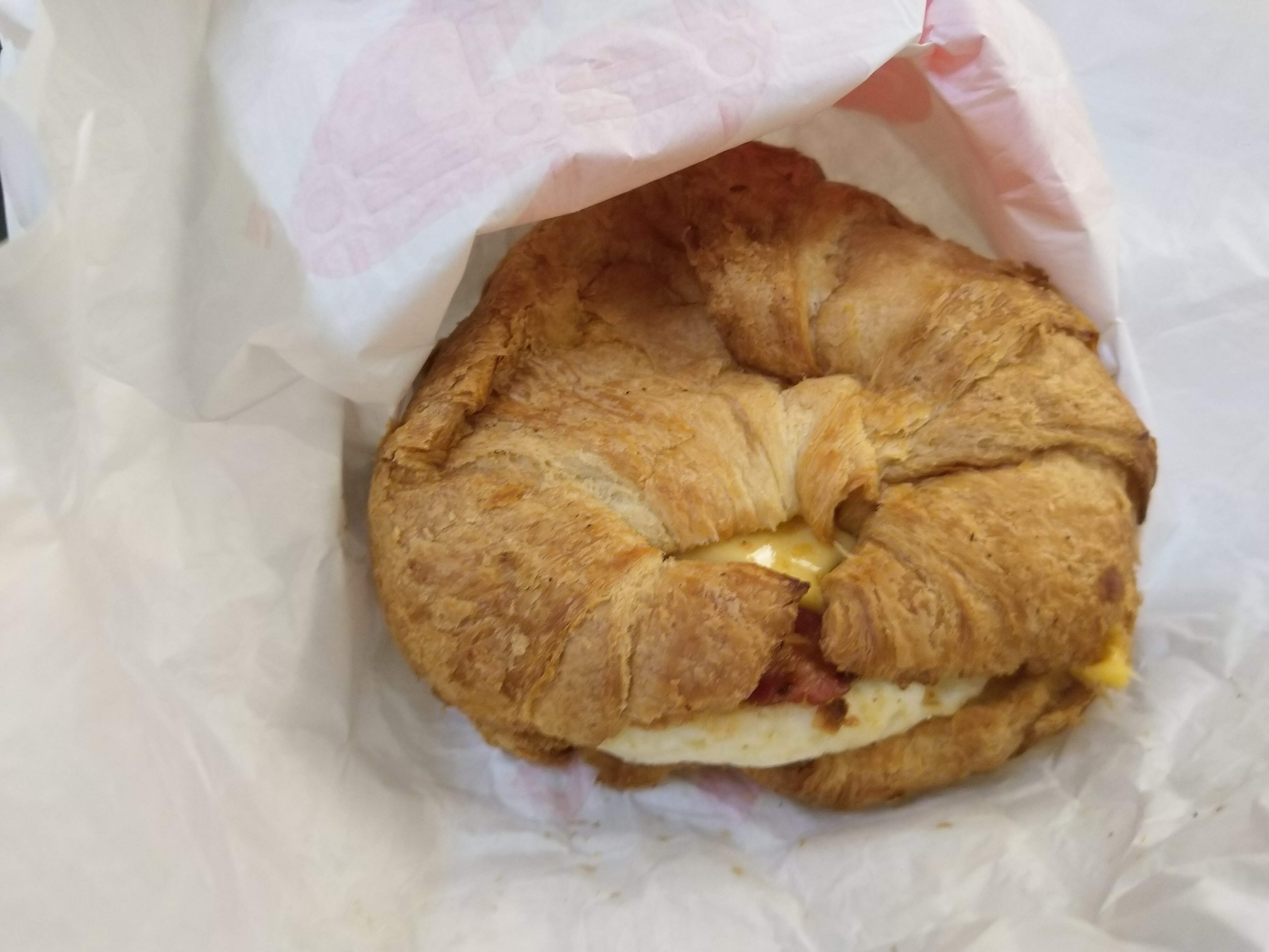 an egg and bacon croissant