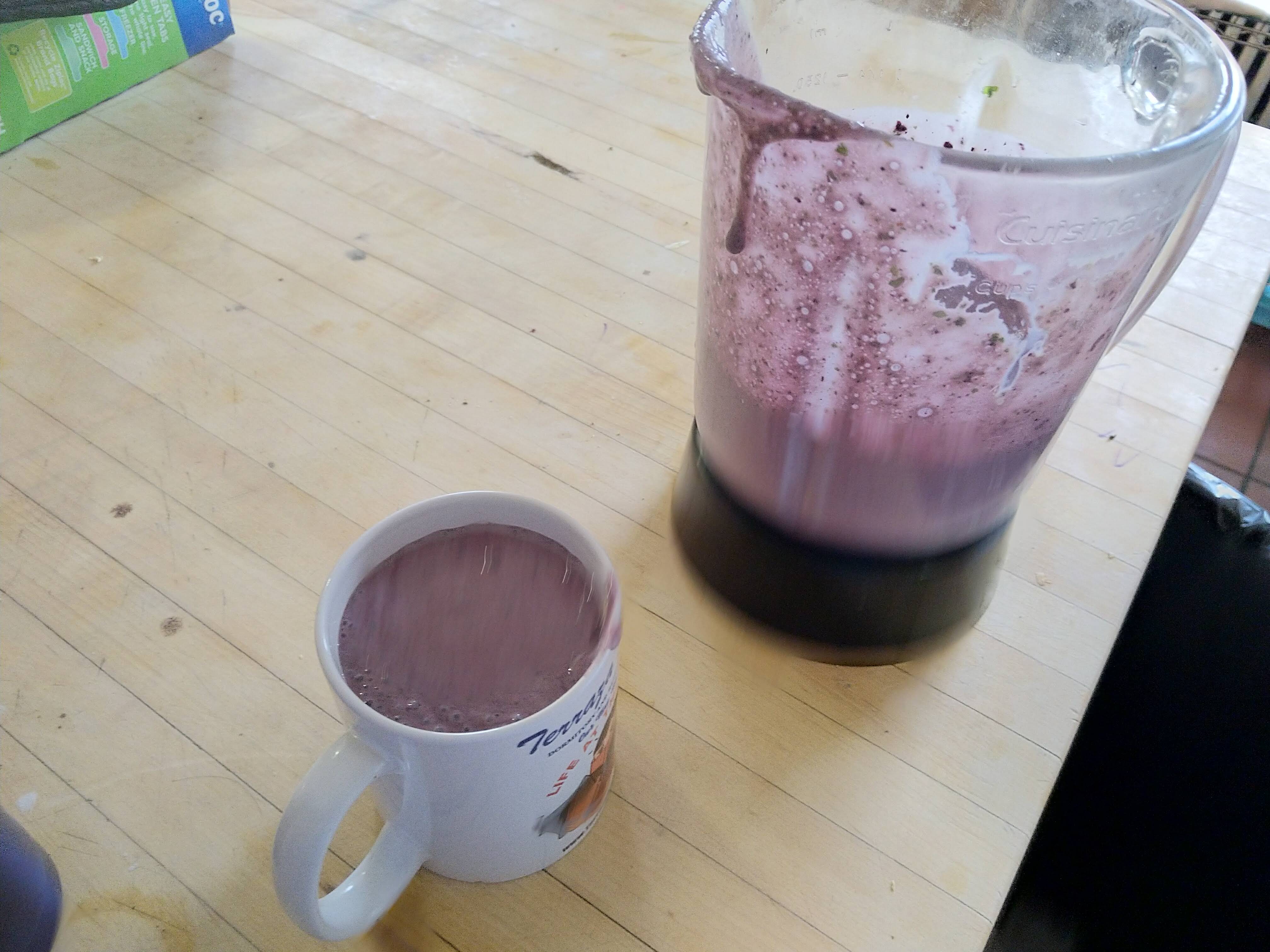 a blender and a mug with smoothieee