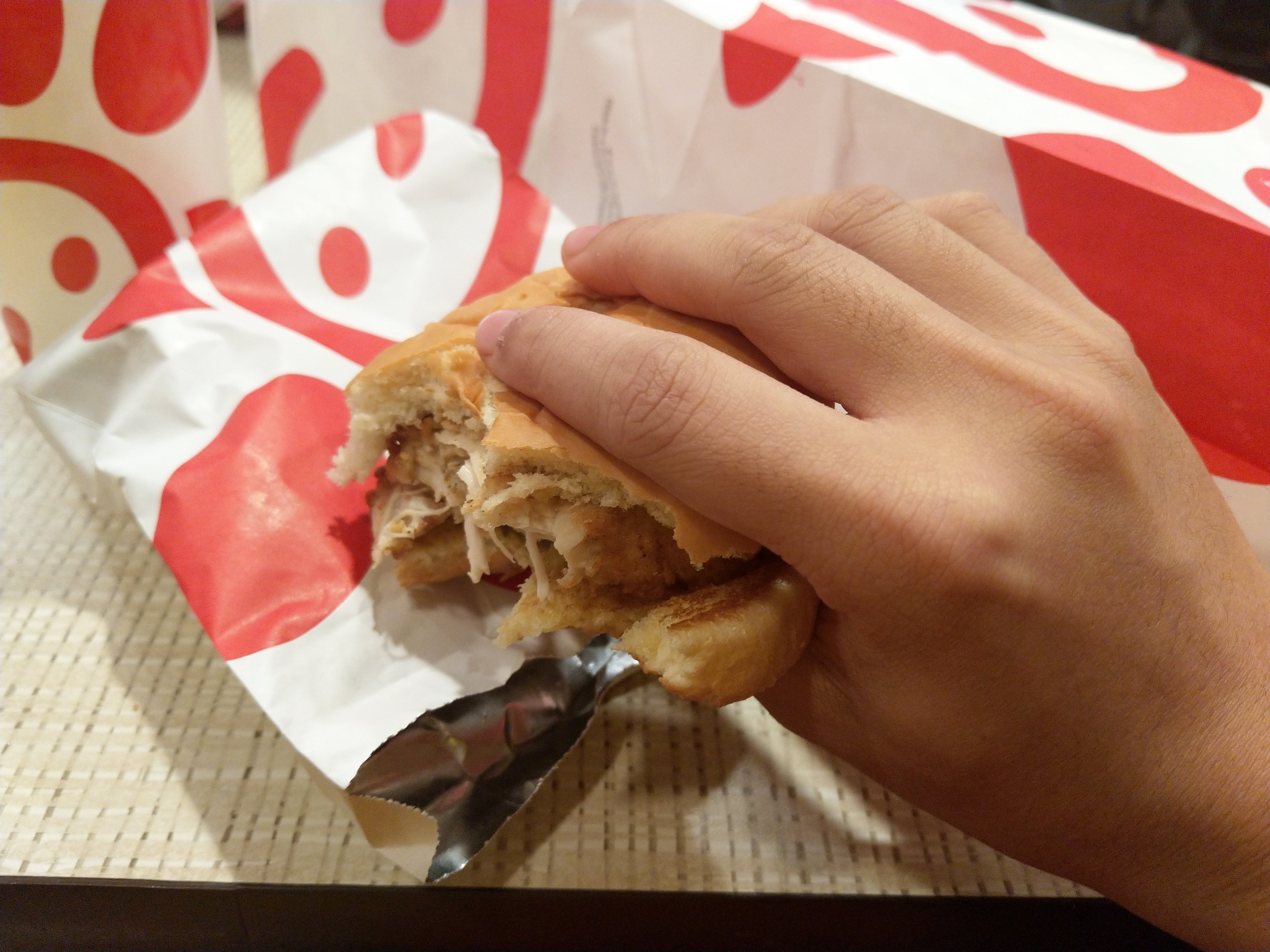 a half-finished chick fil a sandwich