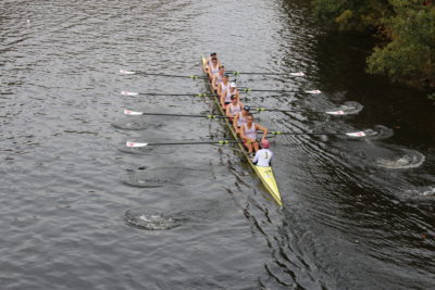 a rowing shell with MIT oars