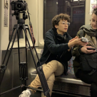 a picture of me and a tripod/camera set up on the train car