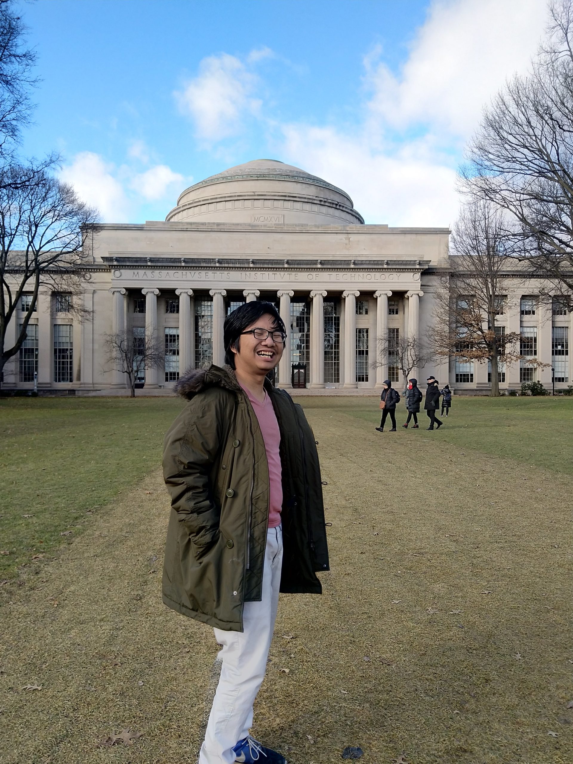 me, smiling, standing in front of the mit's dome