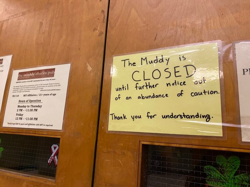 a sign on the door of the muddy charles that says it is closed