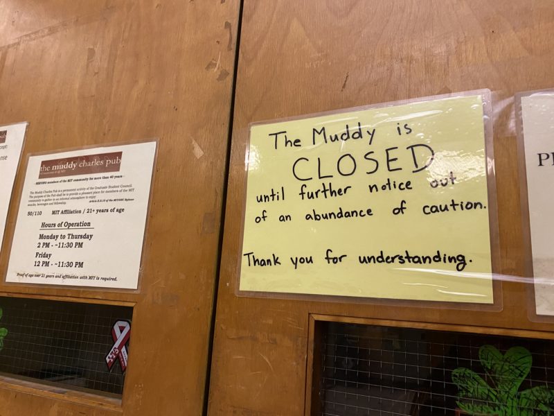 a sign on the door of the muddy charles that says it is closed