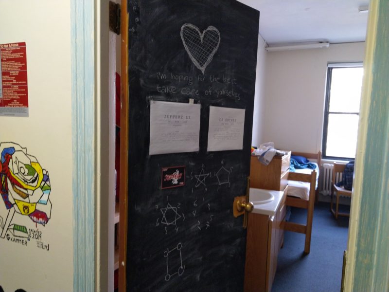 my door after packing some stuff. everything in the past picture is erased. there’s a drawing of a heart on top, and “i’m hoping for the best, take care of yourselves” written underneath.