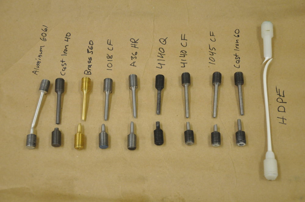 a photo of 10 different rods, all recently broken during testing