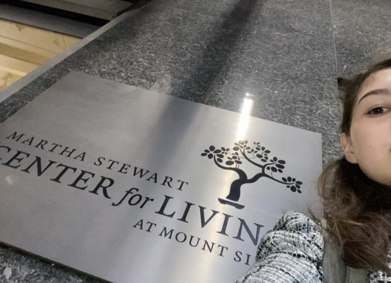 me standing in front of a sign for the martha stewart center for living at mount sinai