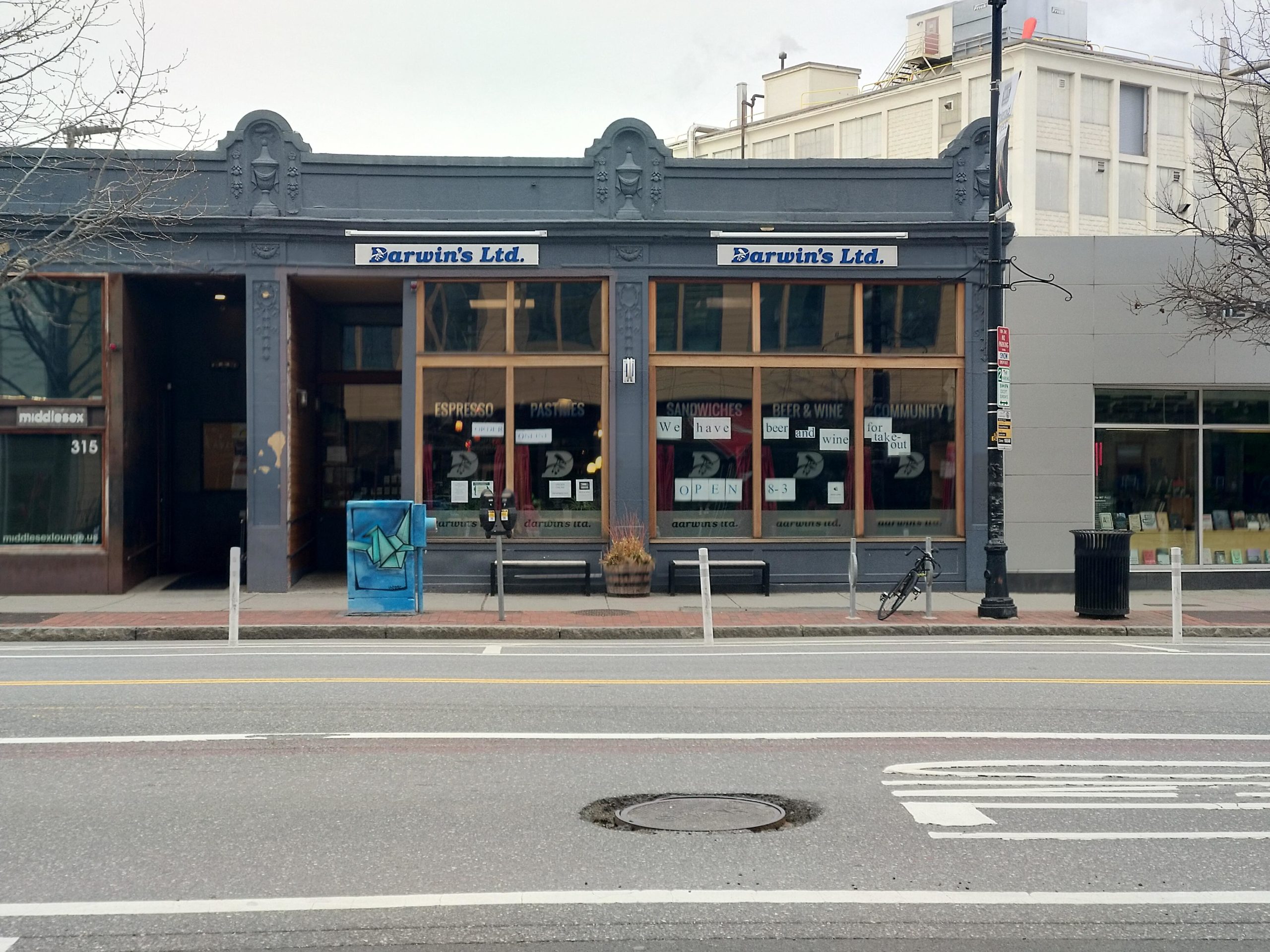 darwin's ltd, a sandwich shop down mass ave near mit, closed, with lots of paper taped on the windows facing out