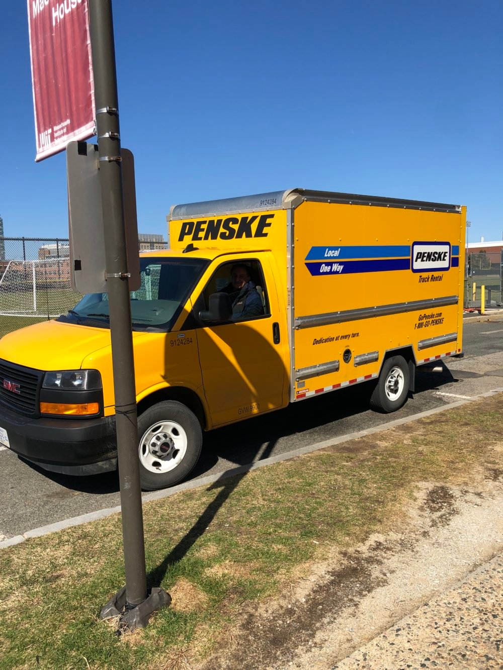 a yellow Penske truck