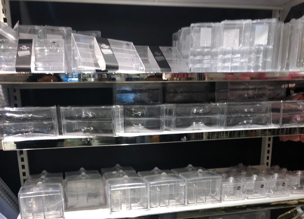 shelf of plastic organizers