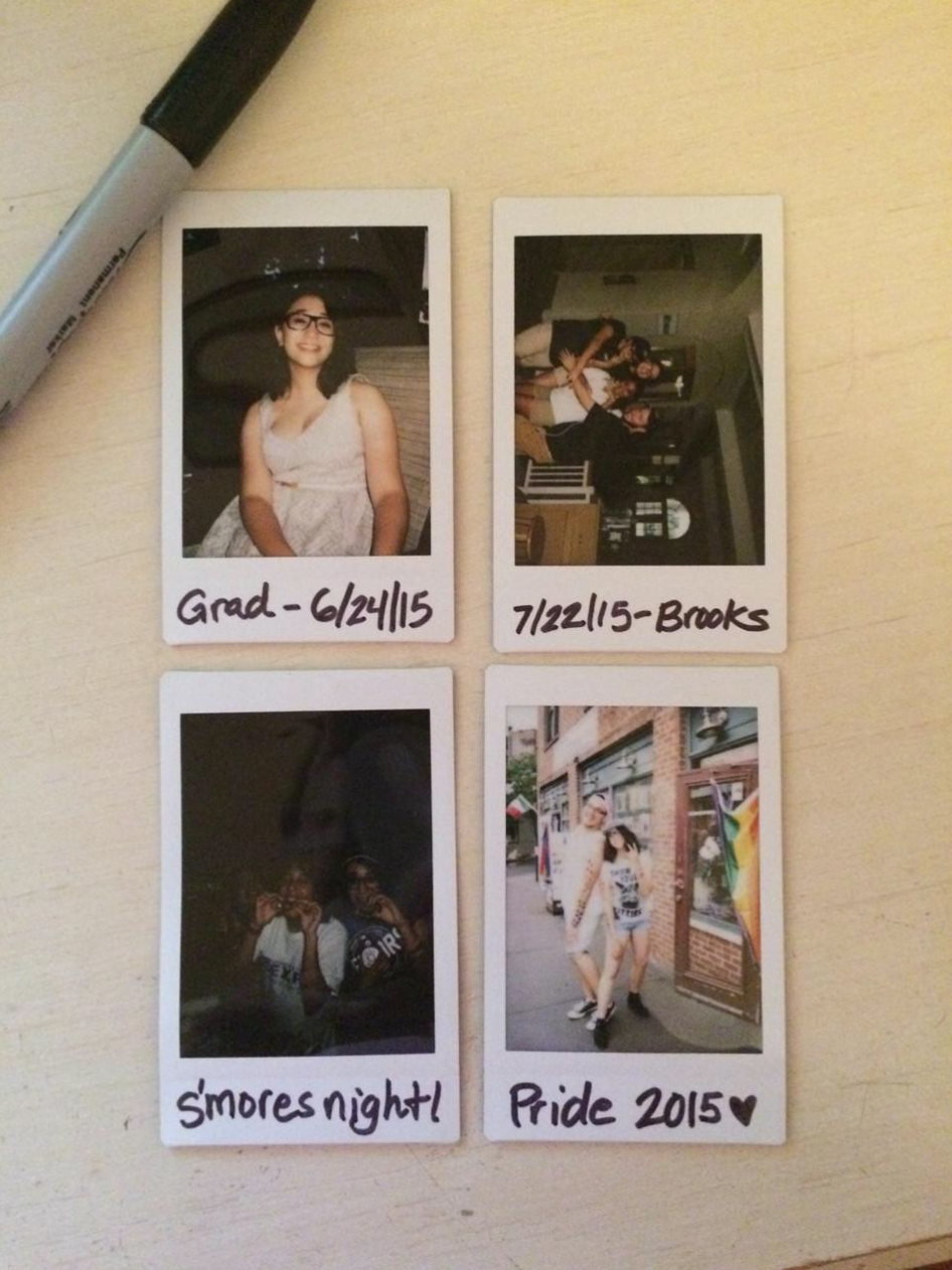 four polaroid photos, one of me at my graduating party, another of my coworkers at the pool, another of me making s'mores, the last one of me at NYC Pride