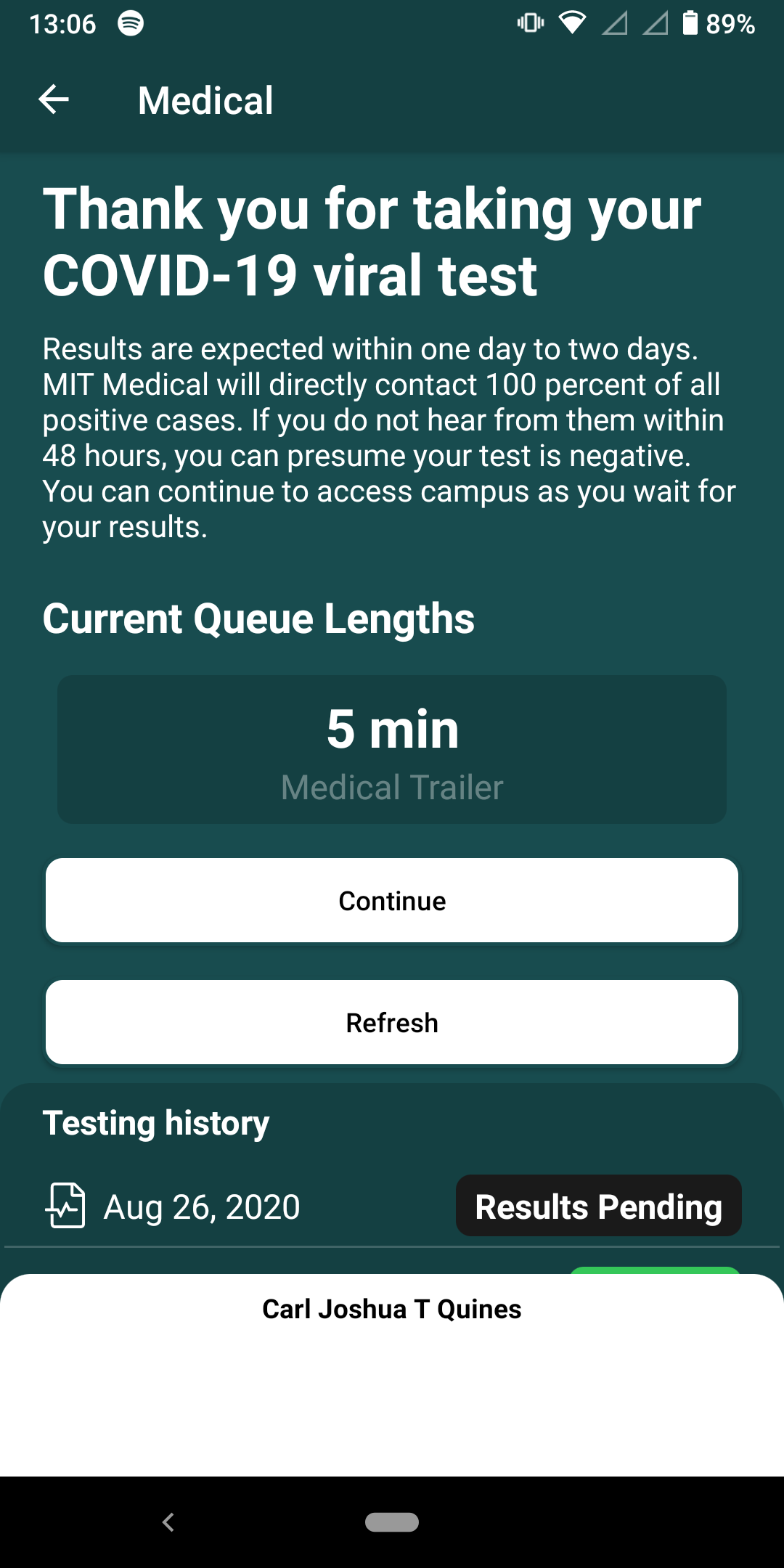 phone screenshot. "Thank you for taking your COVID-19 viral test… Current Queue Lengths 5 min Medical Trailer"