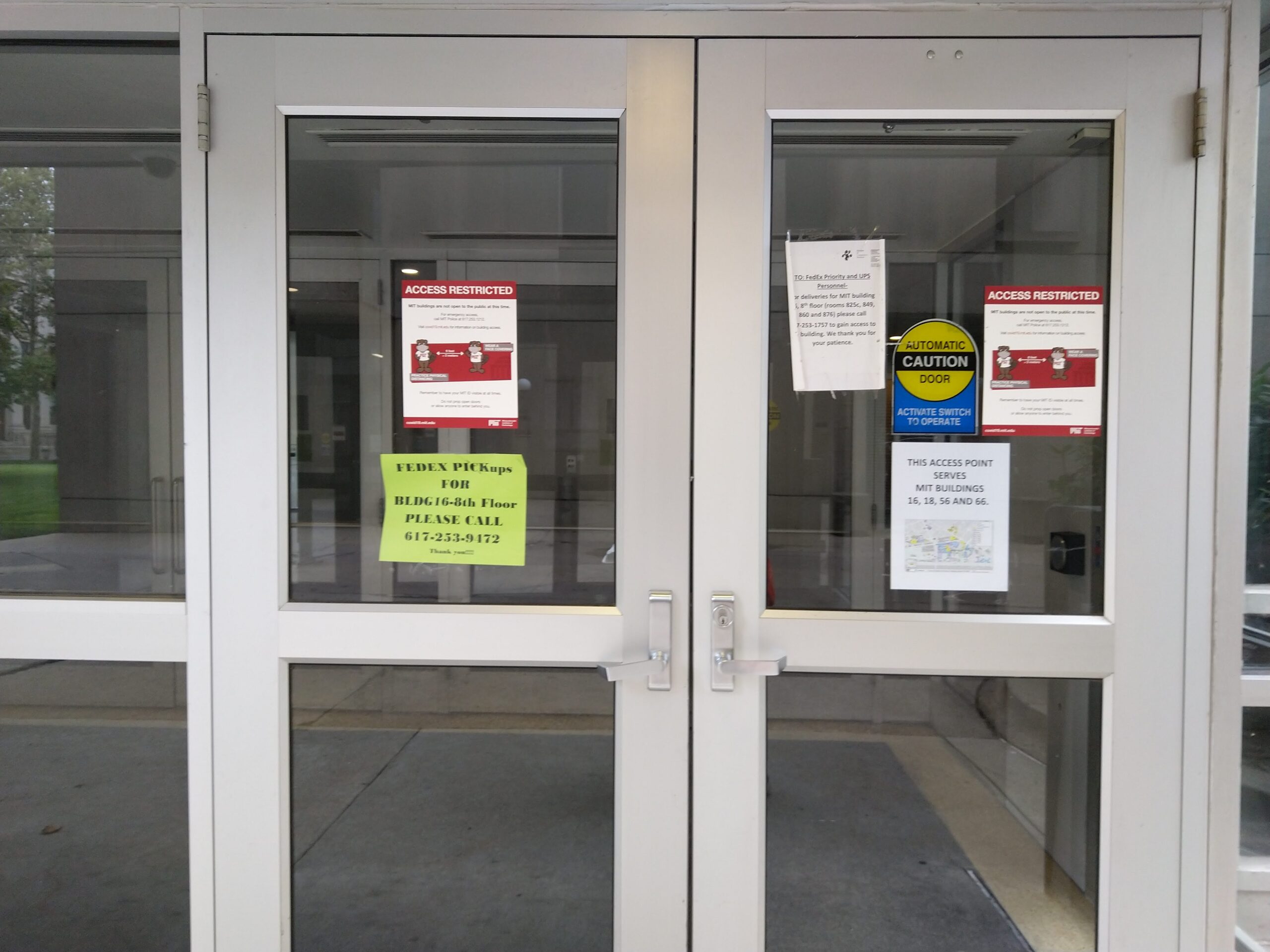 the doors to building 56, with signs saying ACCESS RESTRICTED