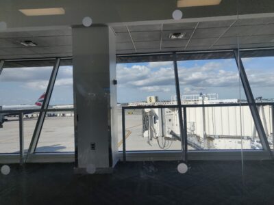 view of planes through an airport glass wall