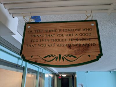 sign hanging in a hallway