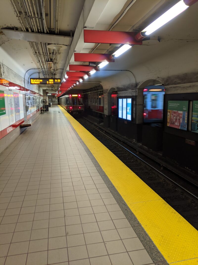 Kendall/MIT T station, with trains entering and leaving