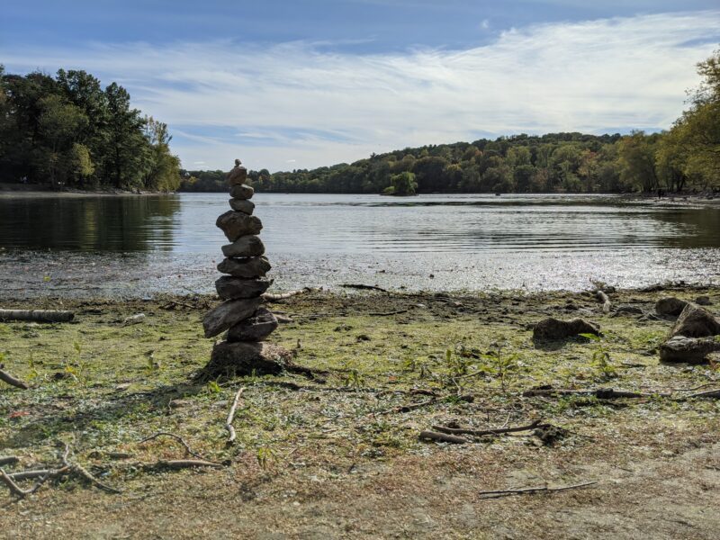 stacked rocks on the shore of Jamaica Pond