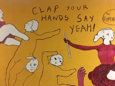 a mural in ec that says "clap your hands say yeah!"