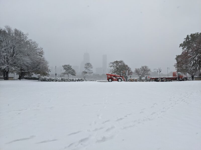 boston skyline faintly suggested through the falling snow