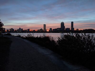 orange peaking out over the boston skyline