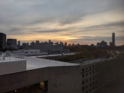 sun peeks over MIT buildings