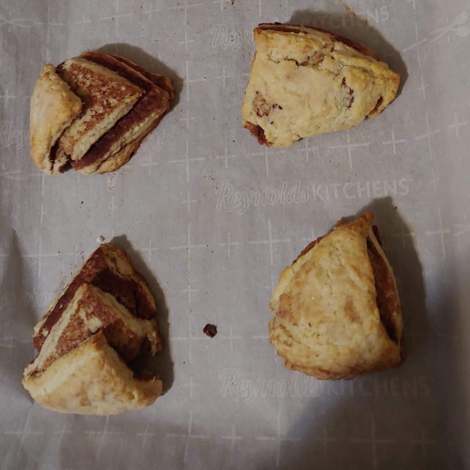 Cinnamon scones on a baking sheet.