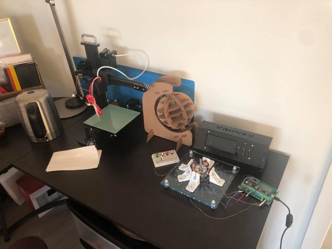 image of a 3d printer, a cardboard globe, and a motor