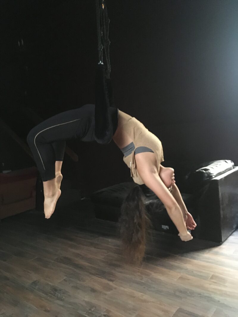 Amber hanging on the trapeze