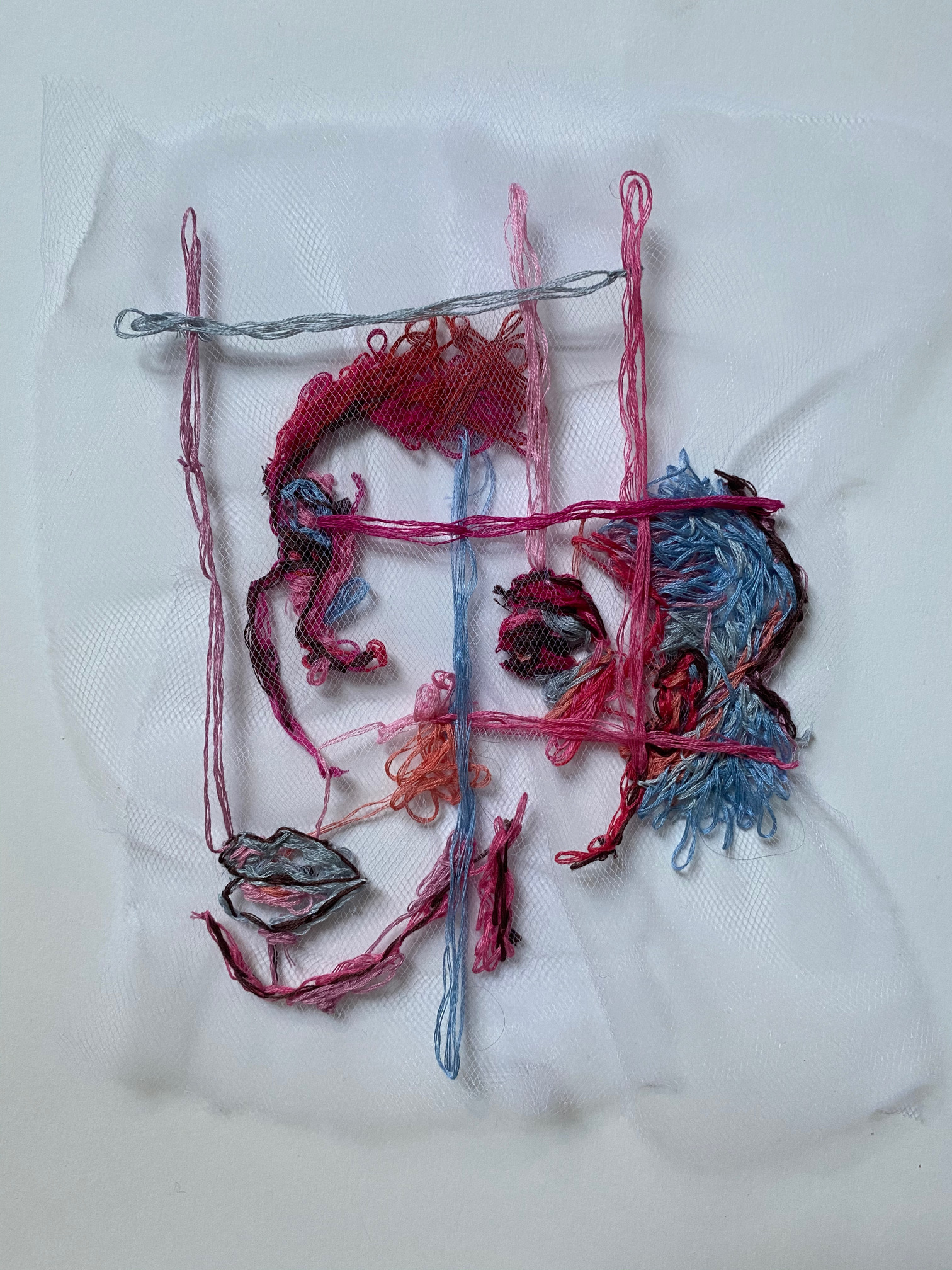 an embroidered abstract face