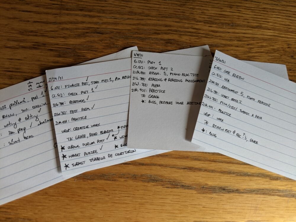 pile of index card to-do lists on a desk