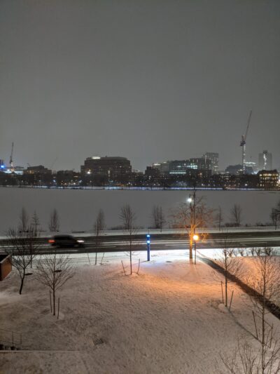 photo of river and a few buildings at night