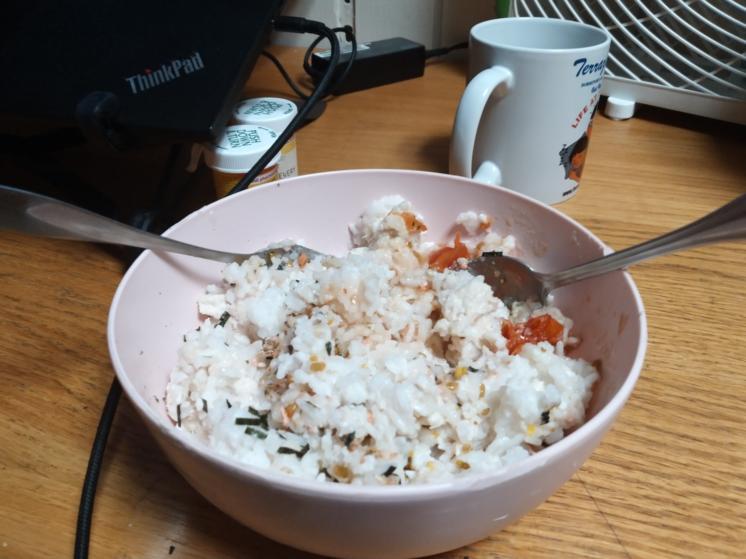 rice with chicken and tomatoes in a bowl