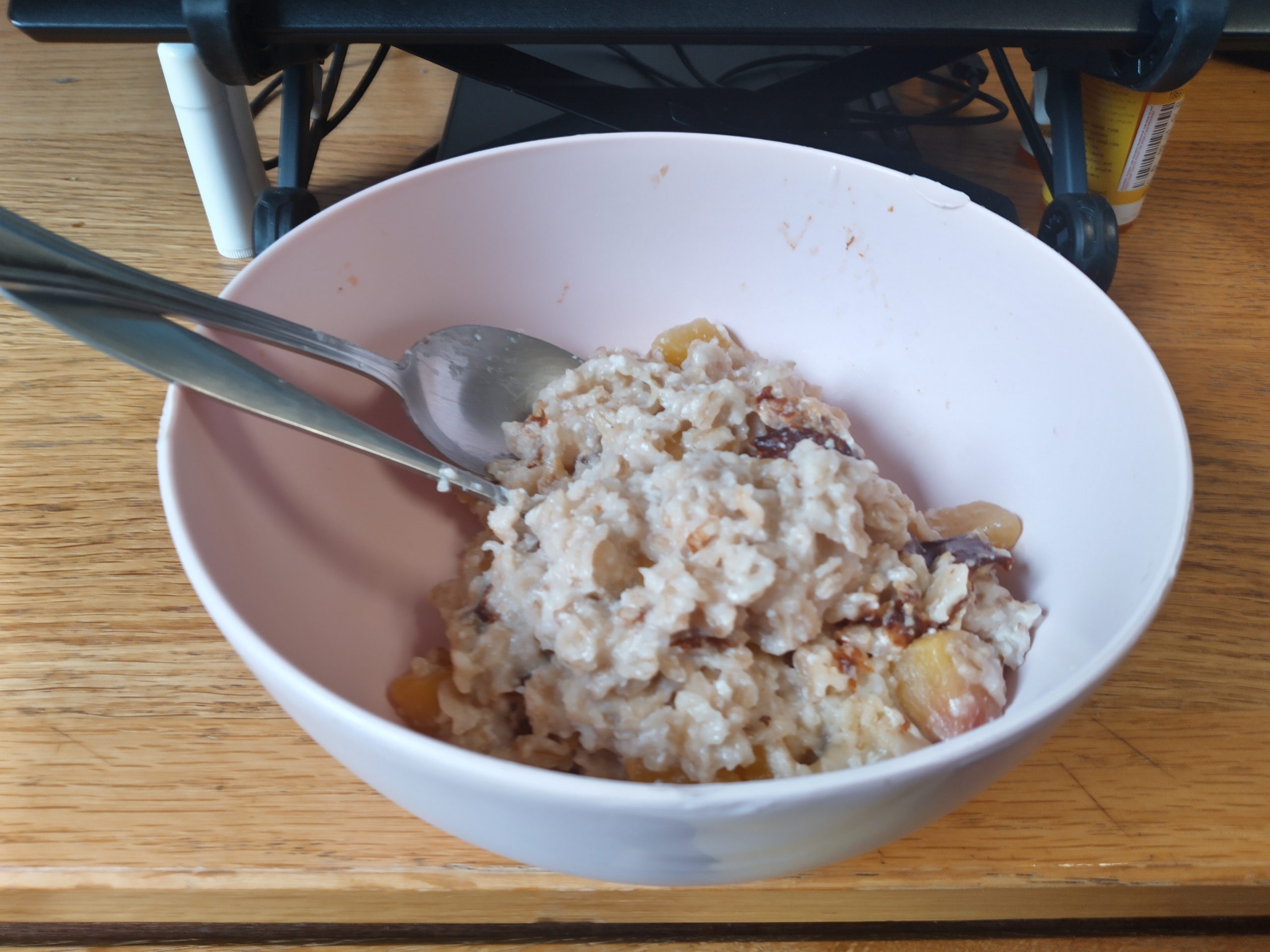 bananas and peaches and oatmeal in a bowl