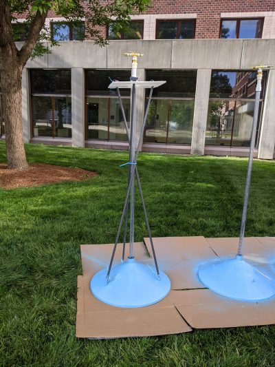 image of methane trap: a blue funnel with a long pipe coming out the top, 5 feet tall, with brass parts on top