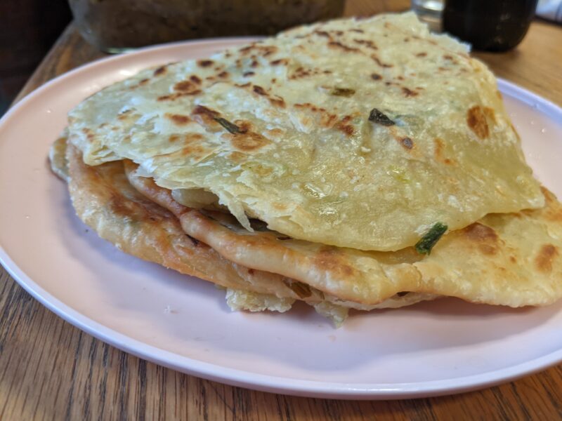 scallion pancakes stacked on a plate