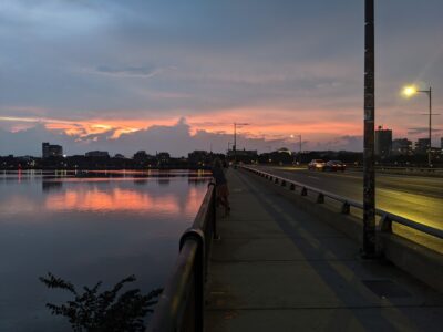 harvard bridge against the charles river and the sunset