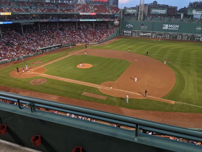 fenway with some players on the baseball field