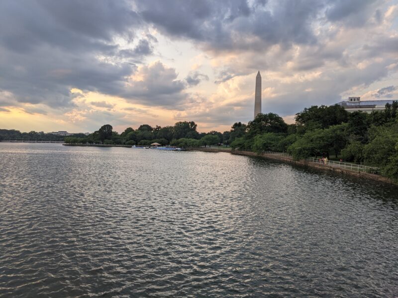 washington monument set against a cloudy sunset above the tidal basin
