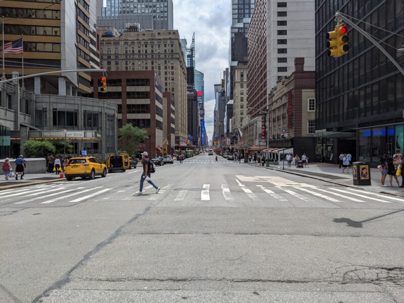 picture facing down the center of a road in NYC