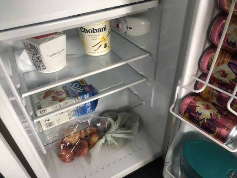 inside of refrigerator with fruit, yogurt, and other groceries